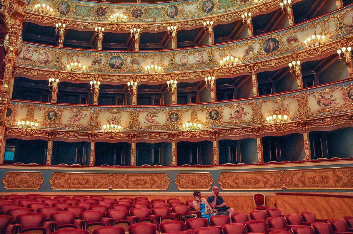 Tourists listening to their audio guides - La Fenice Opera House in Venice, Italy - www.rossiwrites.com