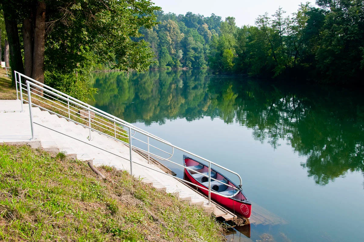 A moored canoe on the river Kolpa, Big Berry glampsite, Bela Krajina, Slovenia - www.rossiwrites.com