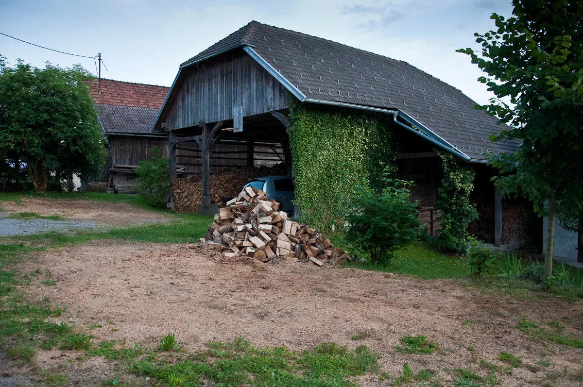 Kozolec - Traditional hayrack barn used to store wood and to park a car, Primostek, Slovenia - www.rossiwrites.com