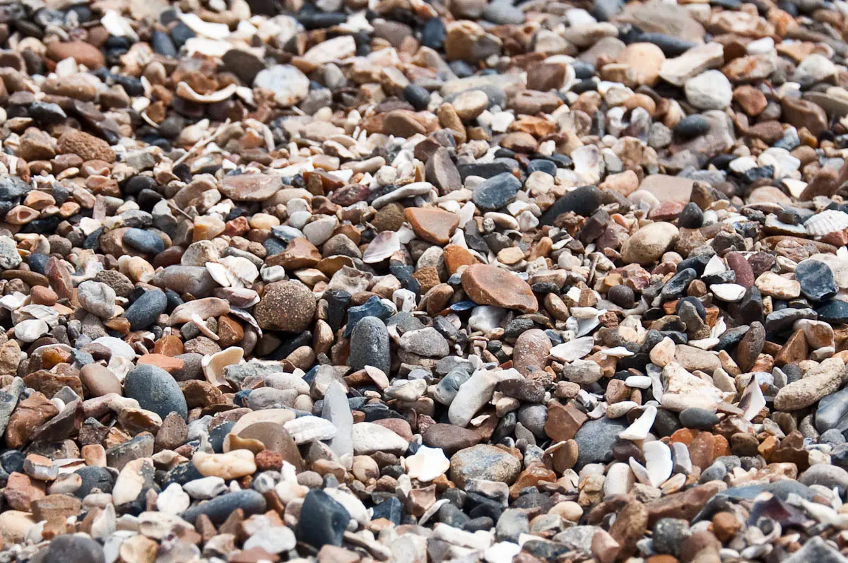 A pebbly beach, Mersea Island, Essex, England - www.rossiwrites.com