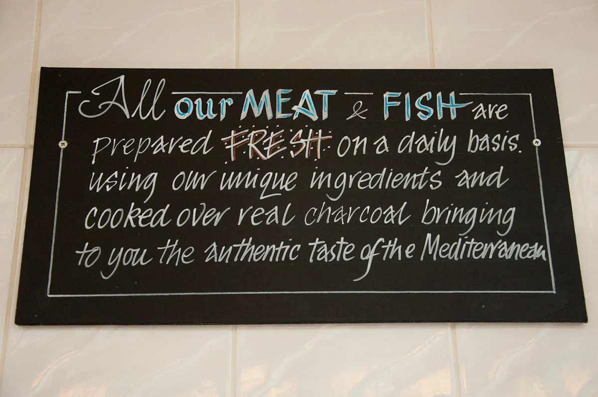 Sign on the wall, The Master Fryer Fish and Chips Shop, St. Albans, England - www.rossiwrites.com