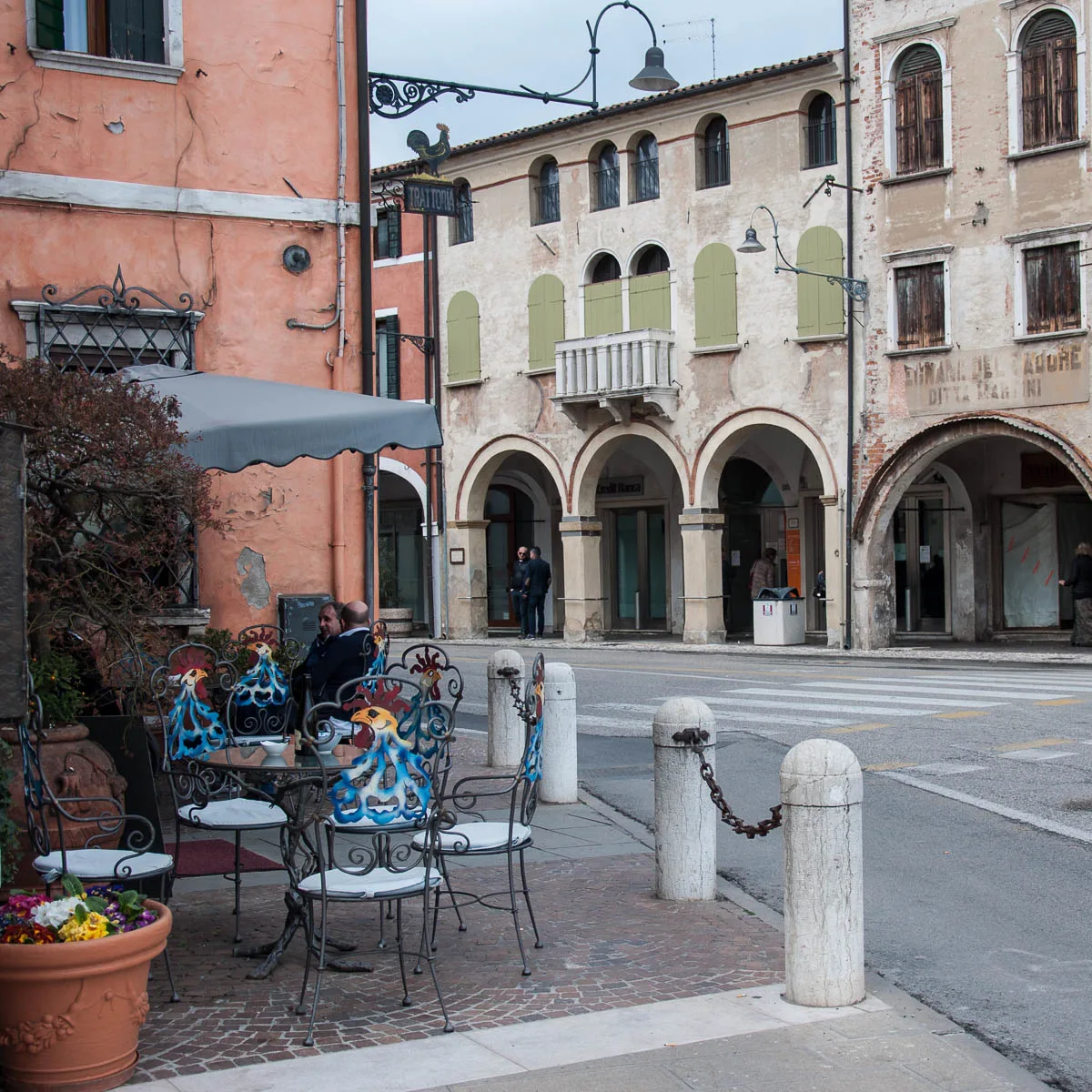 Rooster-inspired chairs in front of a local restaurant - Noale, Veneto, Italy - www.rossiwrites.com