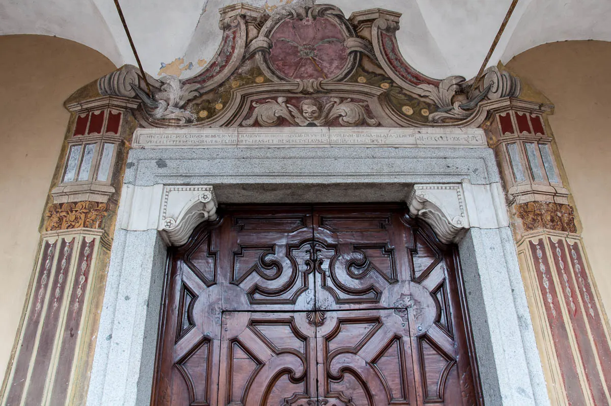 The gate of the St. George's church - Bagolino, Lombardy, Italy - www.rossiwrites.com