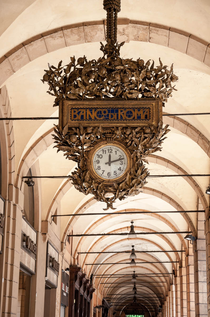 A large clock of Banco di Roma in one of Bologna's arcades - Bologna, Emilia-Romagna, Italy - www.rossiwrites.com