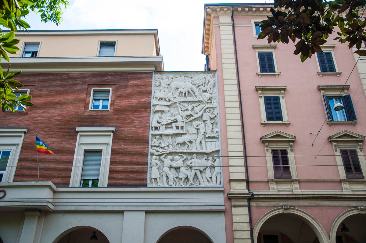 A stone bas-relief on large buildings - Bologna, Emilia-Romagna, Italy - www.rossiwrites.com