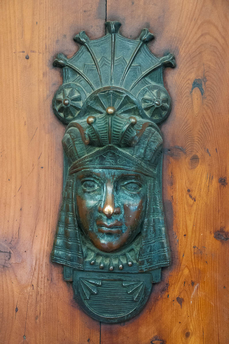 An Egyptian-inspired door knocker and lock - Bologna, Emilia-Romagna, Italy - www.rossiwrites.com