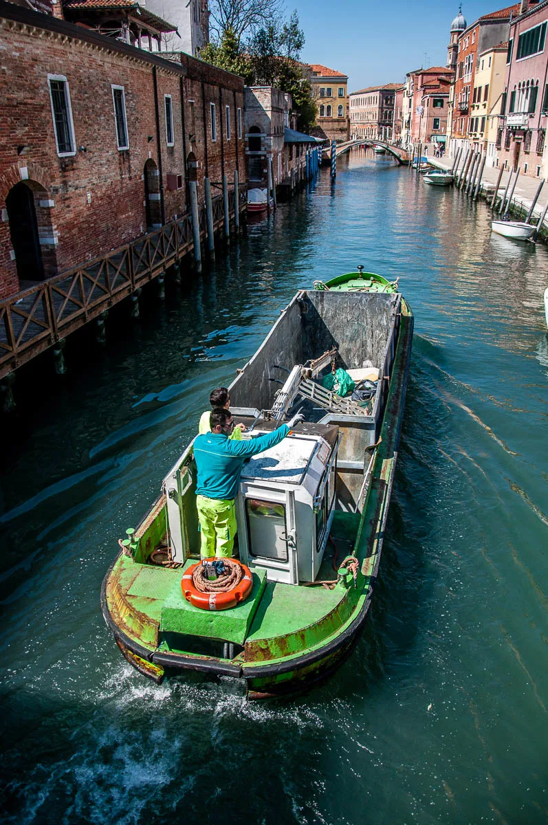 A rubbish-collecting boat - Venice, Italy - www.rossiwrites.com