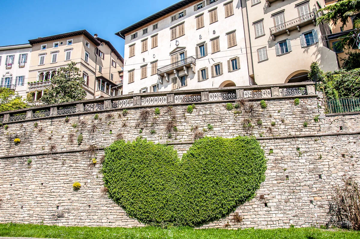 View of Bergamo's Upper City with heart-shaped ivy on the defensive walls - Bergamo, Lombardy, Italy - www.rossiwrites.com