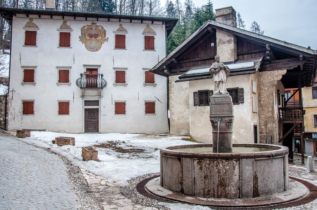 Side view of Titian's birth house with a fountain and a 16th century palace - Pieve di Cadore - Province of Belluno, Veneto, Italy - www.rossiwrites.com