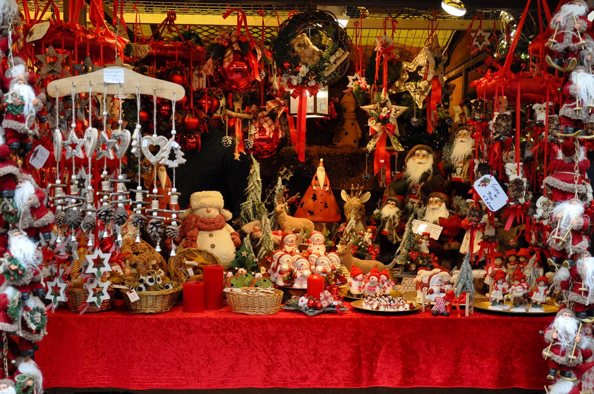 A stall selling red and white Christmas decorations - Christmas Market - Verona, Italy - www.rossiwrites.com