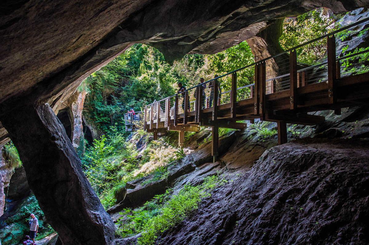 The walkway leading into a cave - Grotte di Caglieron, Fregona, Veneto, Italy - www.rossiwrites.com