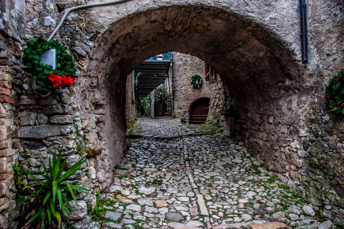A cobbled street and a stone passage - Campo di Brenzone, Lake Garda, Italy - www.rossiwrites.com