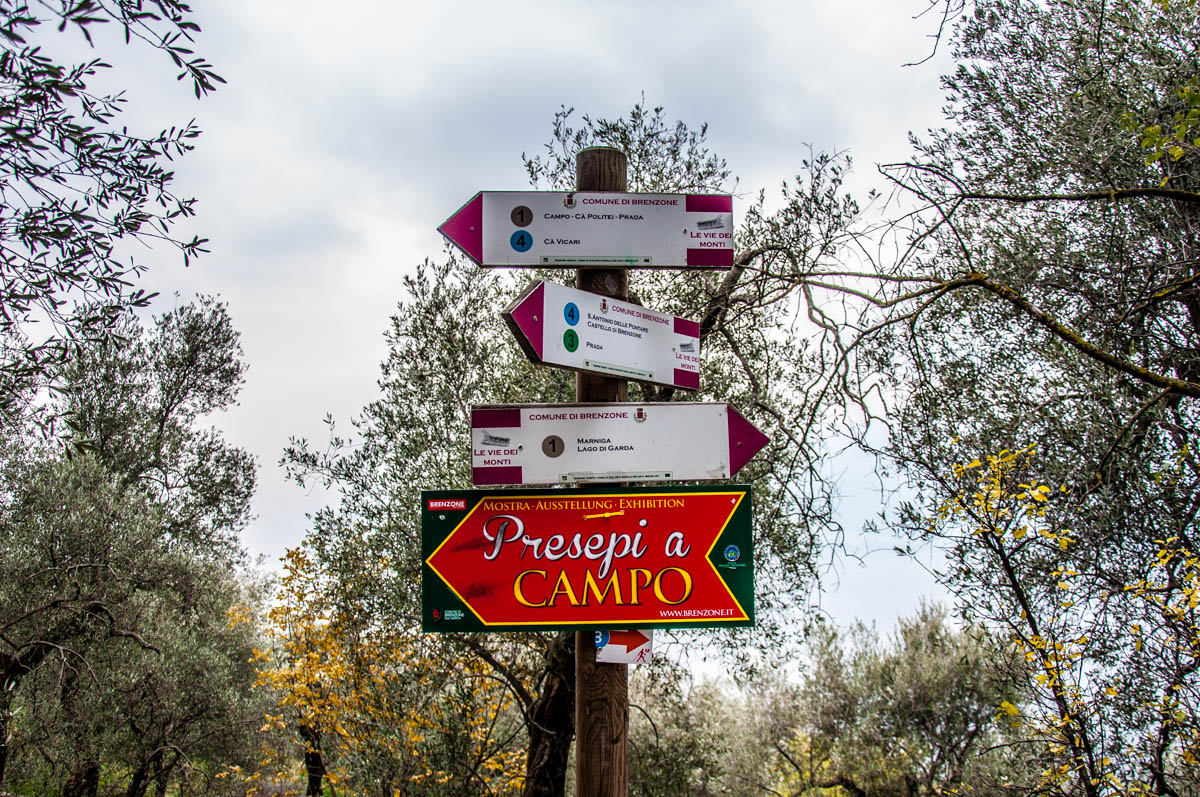 Signs among the olive groves - Campo di Brenzone, Lake Garda, Italy - www.rossiwrites.com