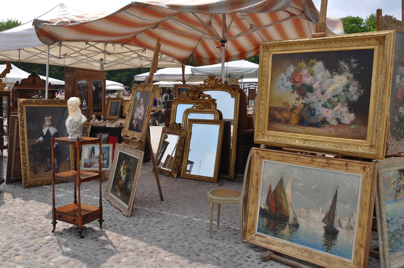 Stall with paintings at the antiques market in Piazzola sul Brenta, Veneto, Italy