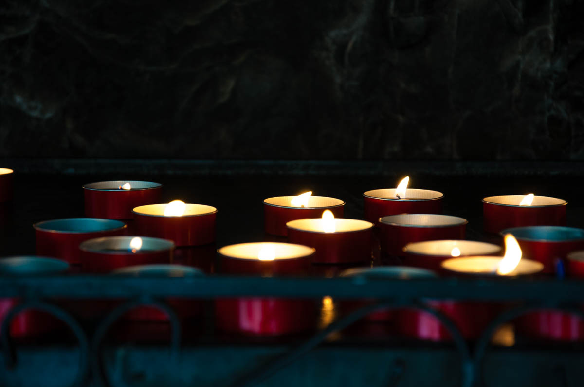 Lit candles - Sanctuary of Madonna della Corona - Spiazzi, Veneto, Italy - www.rossiwrites.com