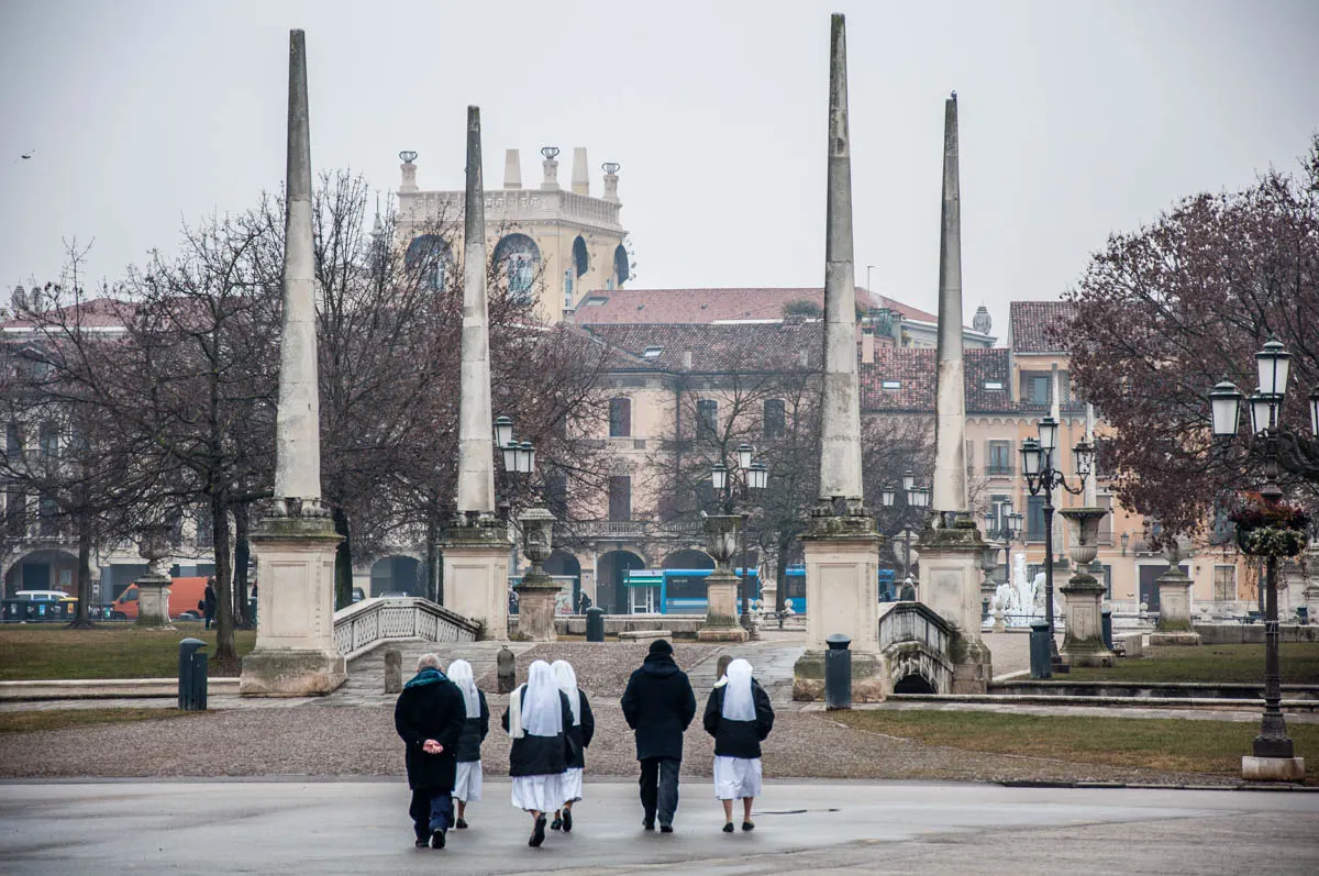 A group of nuns and priests walking on Prato della Valle - Padua, Italy - rossiwrites.com