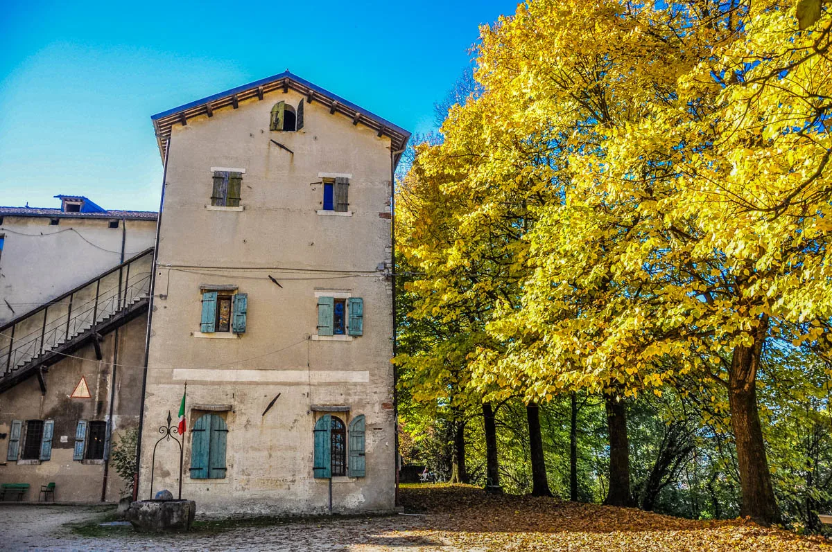Feltre castle with trees in autumn - Feltre, Veneto, Italy - rossiwrites.com