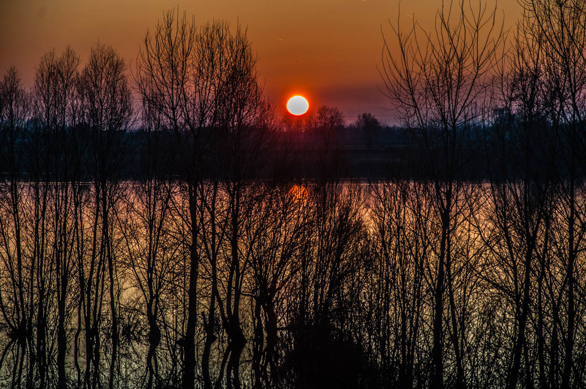 A fiery sunset over lake Camazzole - Province of Padua, Veneto, Italy - rossiwrites.com