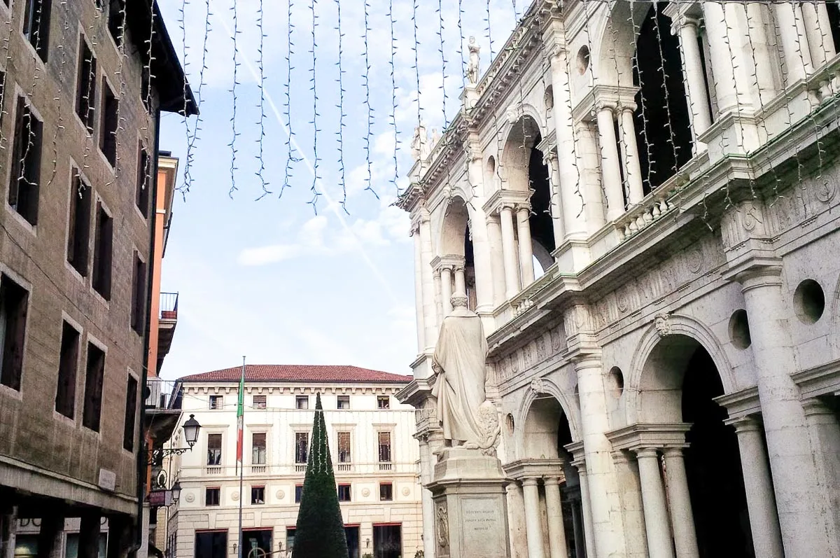 A curtain of Christmas lights hanging over Palladio's monument and the Basilica Palladiana - Vicenza, Italy - rossiwrites.com