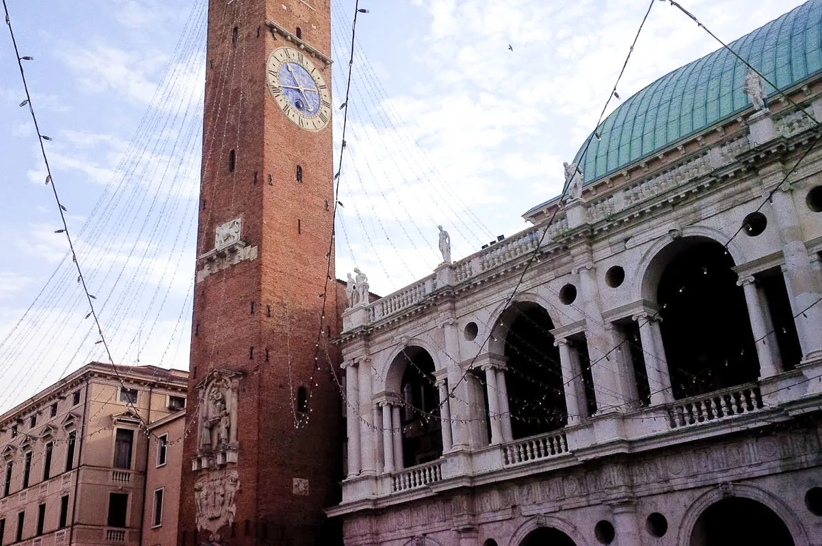 Christmas lights hang from the Torre Bissara next to the Basilica Palladiana - Vicenza, Italy - rossiwrites.com