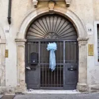 A child is born - a blue bow decorates the entrance door of a house in Vicenza signaling that a baby boy has been borne into the home