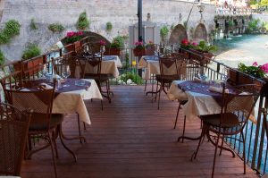 The terrace over the river Mincio of Cafe Visconti, Borghetto sul Mincio, Italy