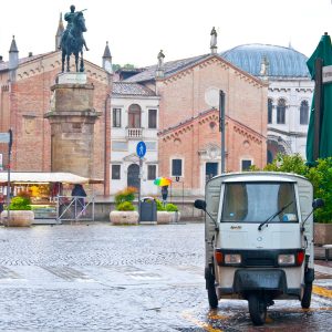 Ape50 and Donatello's equestrian statue in the rain, Padua, Veneto, Italy - www.rossiwrites.com