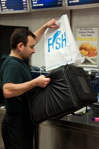 Packing a home delivery, The Master Fryer Fish and Chips Shop, St. Albans, England - www.rossiwrites.com