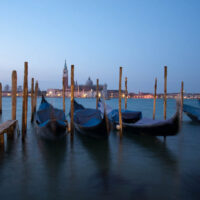 Gondolas and the island of San Giorgio Maggiore early in the morning - Venice, Italy - rossiwrites.com