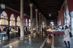 Shoppers and fishmongers' stalls in the big market hall - Rialto Fish Market, Venice, Italy - www.rossiwrites.com