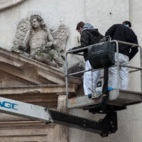 Two workers are cleaning the statues on a church facade - Vicenza, Italy - www.rossiwrites.com