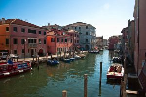 A canal with boats - Chioggia, Veneto, Italy - www.rossiwrites.com