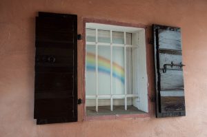 Window with wooden shutters and a rainbow - Noale, Veneto, Italy - www.rossiwrites.com
