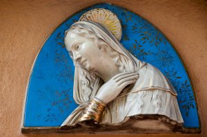 A majolica Virgin Mary adorning a house wall - Rovereto, Trentino, Italy - www.rossiwrites.com
