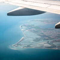 Italy from above - The wing of a plane over the Italian Adriatic coast - www.rossiwrites.com