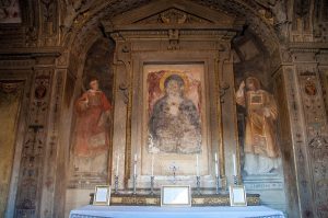 An altar covered with faded frescos - Basilica of Santo Stefano - Bologna, Emilia-Romagna, Italy - www.rossiwrites.com