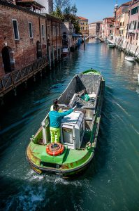 A rubbish-collecting boat - Venice, Italy - www.rossiwrites.com
