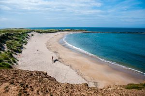 A small sandy beach - Holy Island of Lindisfarne, Northumberland, England - www.rossiwrites.com