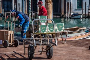 Unloading boxes with prosecco off a boat - Venice, Veneto, Italy - www.rossiwrites.com