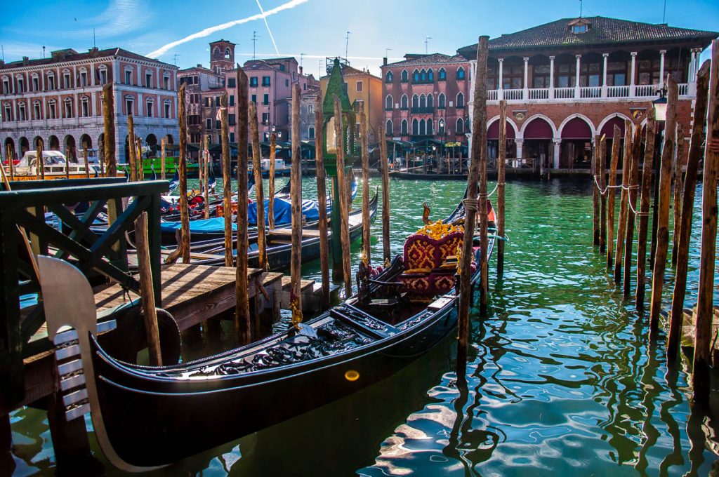 Venetian gondola on the Grand Canal and opposite Rialto Fish Market - Venice, Italy - rossiwrites.com