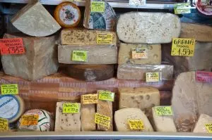 Cheese shop window display on the ground floor of Palazzo della Raggione - Piazza delle Erbe - Padua, Italy - www.rossiwrites.com