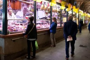 Shopping at the butcher's on the ground floor of Palazzo della Raggione, Piazza delle Erbe, Padua, Italy - www.rossiwrites.com