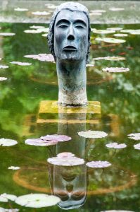The sculptural head in the pond - Castello di San Pelagio, Province of Padua, Veneto, Italy - www.rossiwrites.com