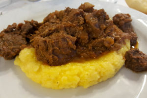 Creamy polenta with sauce from boar - Lombardy, Italy - www.rossiwrites.com