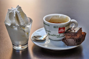 Decaffeinated espresso with whipped cream and a bite-size cake - Vicenza, Italy - rossiwrites.com