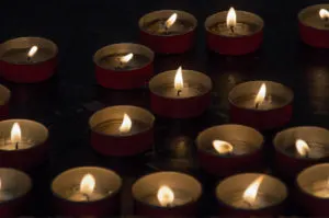 Lit candles - Sanctuary of Madonna della Corona - Spiazzi, Veneto, Italy - rossiwrites.com