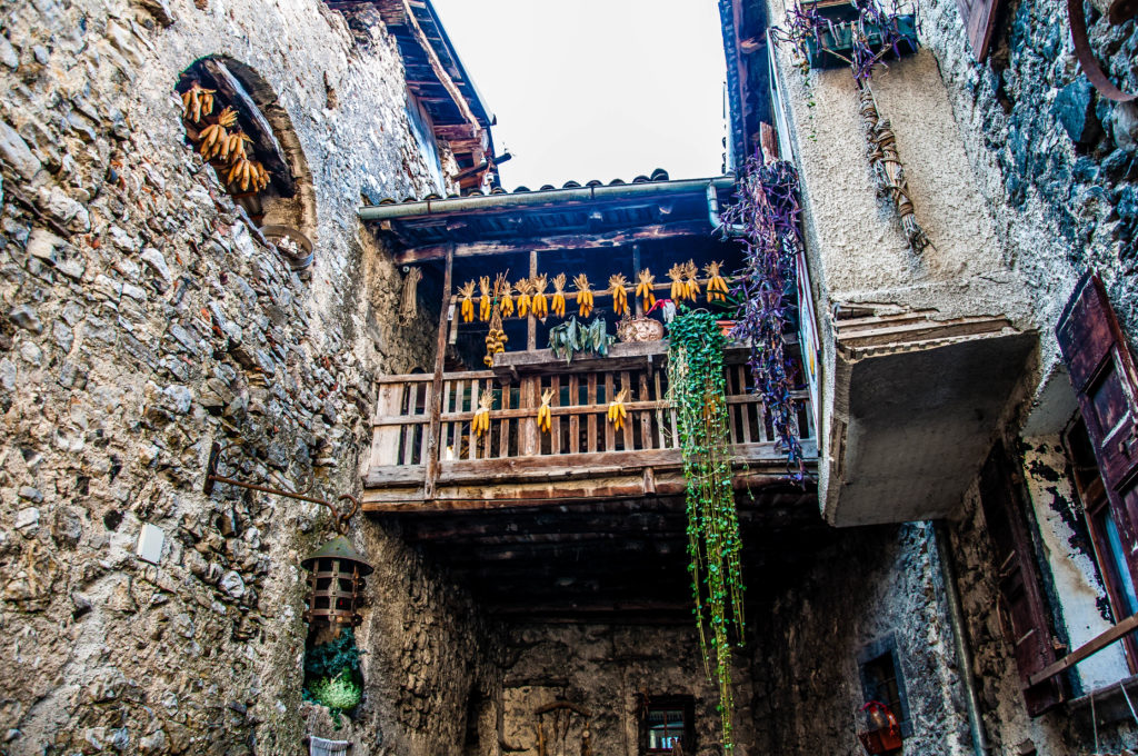 A balcony with corncobs in Canale di Tenno - Trentino, Italy - www.rossiwrites.com