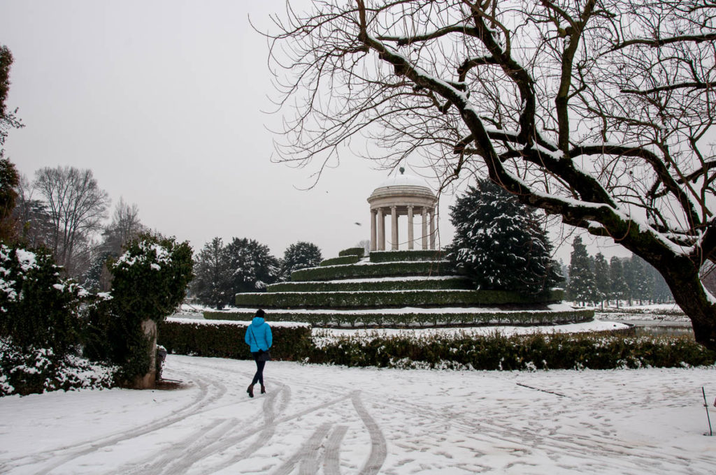 A woman in a blue jacket in the white snow - Parco Querini, Vicenza, Veneto, Italy - rossiwrites.com