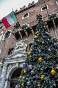 Palazzi Scaligeri with a Christmas tree and the Italian flag - Christmas Market - Verona, Italy - rossiwrites.com
