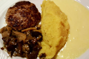 Luganega sausage with polenta, melted cheese and mushrooms - Capanna Passo Valles - Dolomites, Trentino, Italy - rossiwrites.com